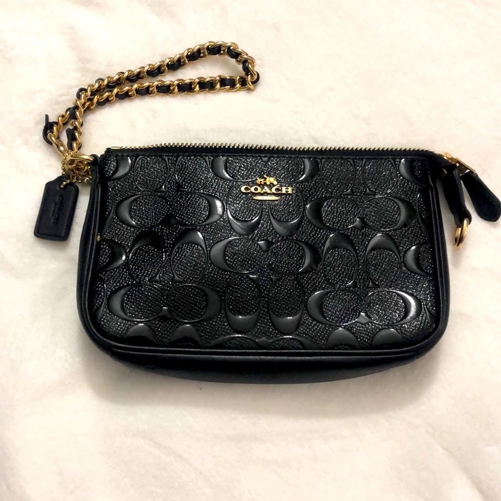 Black Coach wrist clutch.